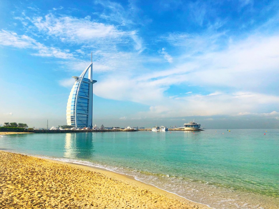 the-iconic-burj-al-arab-hotel-architecture-design-structure-dubai-beach-sand-ocean-water-blue-skies_t20_goQPvY