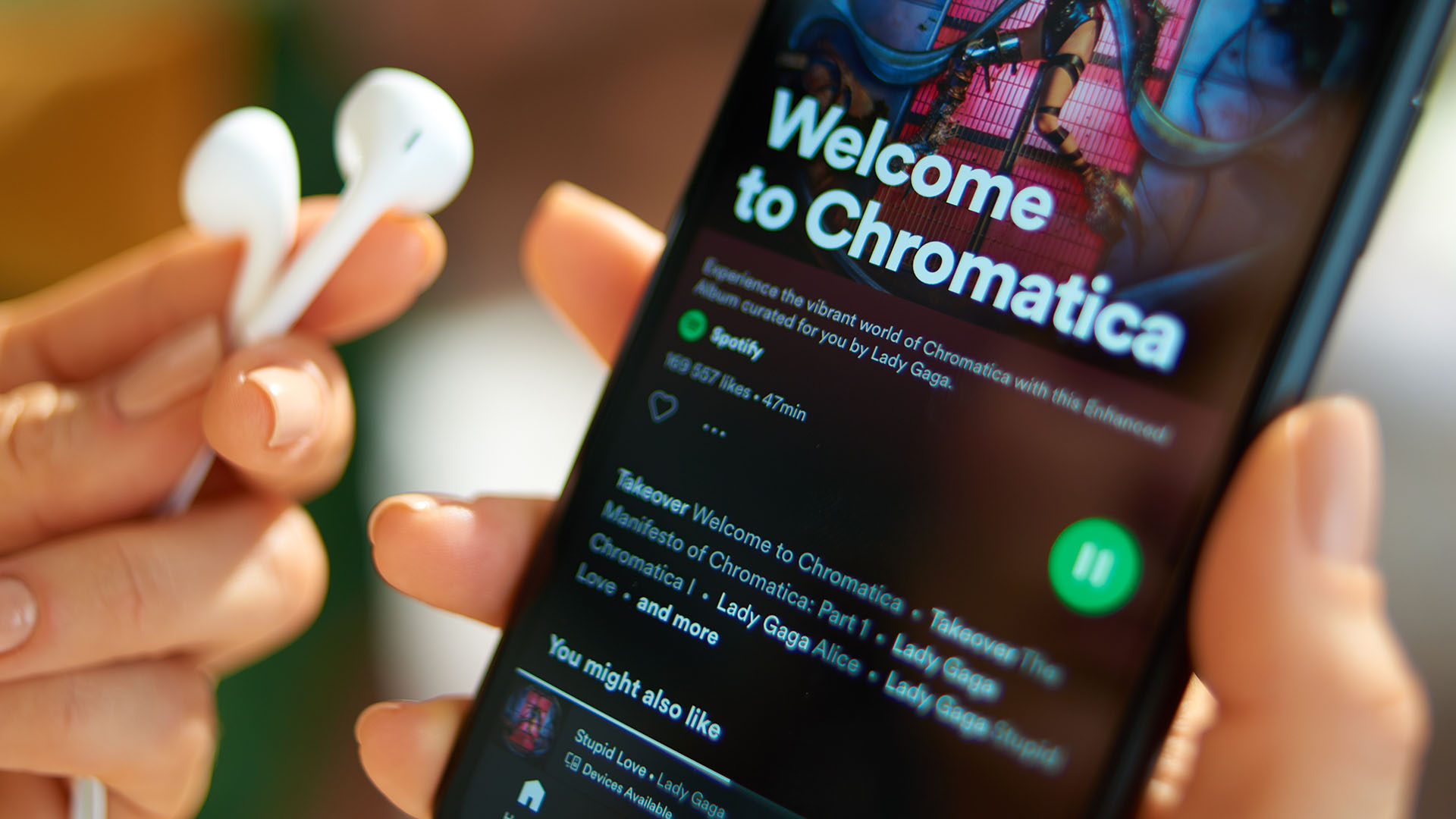 smartphone with Lady Gaga album Chromatica playing on Spotify
